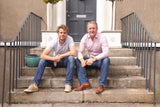 Andrew Felton and Wendel Armstrong image sitting on steps. Co-founders of OOST Nutrition