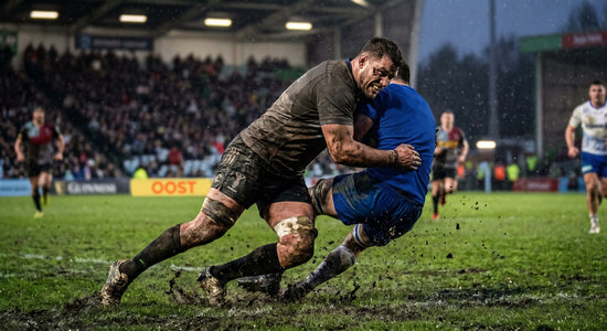 Rugby tackle on a wet pitch. OOST marine collagen supplement conditions tendons to transmit explosive power into contact.