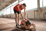 Image of two people completing a stretching exercise